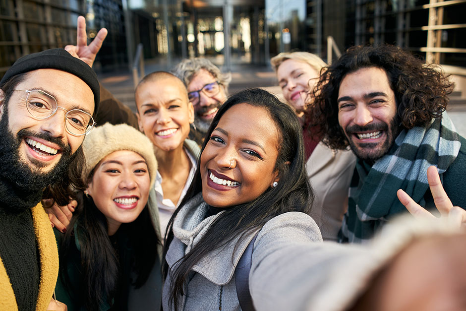 Diverse team smiling together outside office building in Ireland